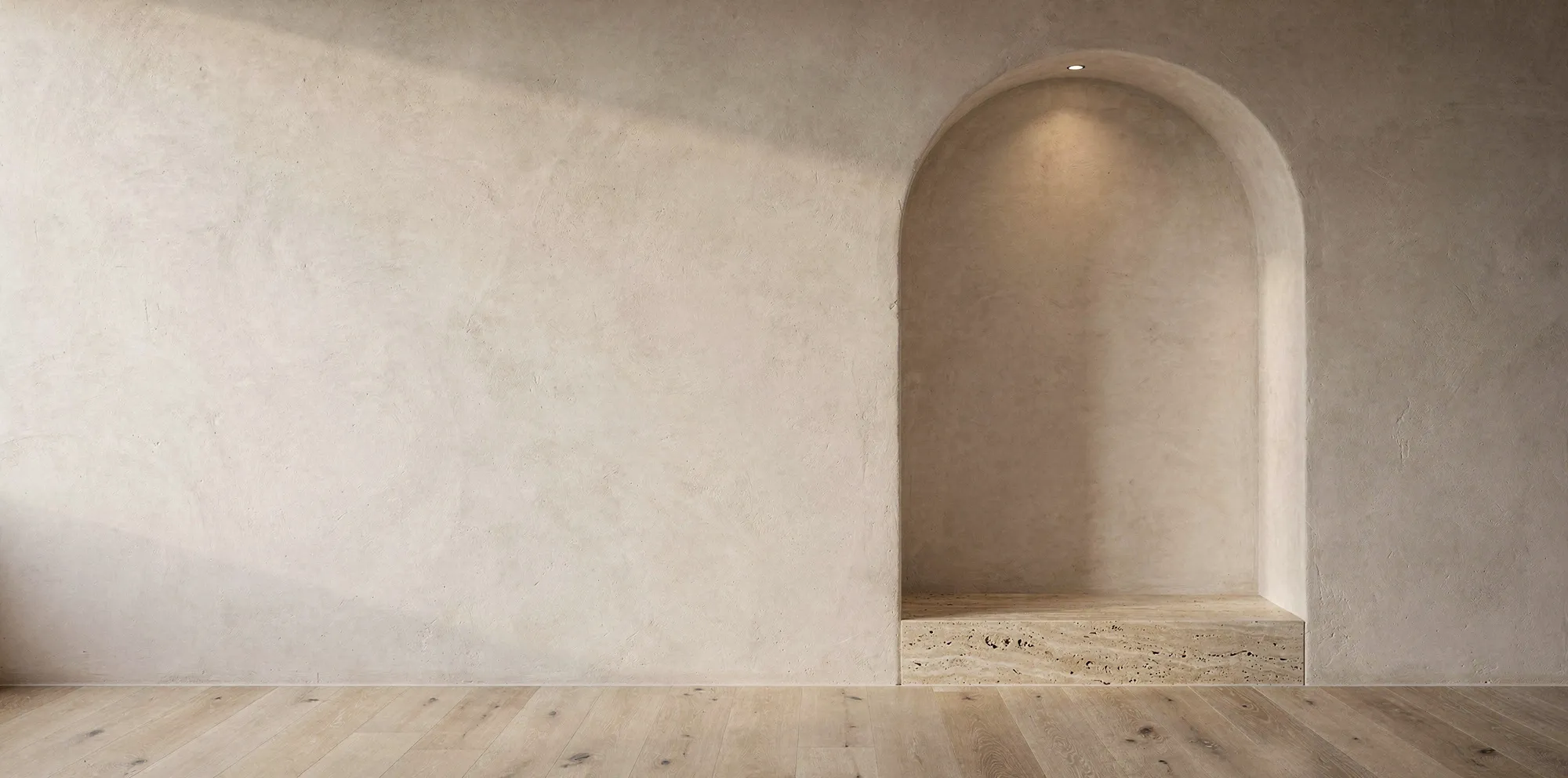 Arched alcove in lime plaster with a travertine bench